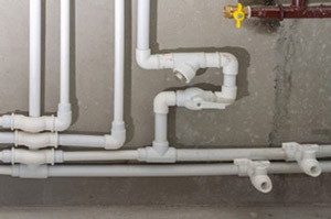 New white PVC pipes installed in home plumbing system