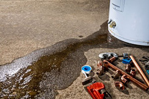 Professional installing new water heater with tools